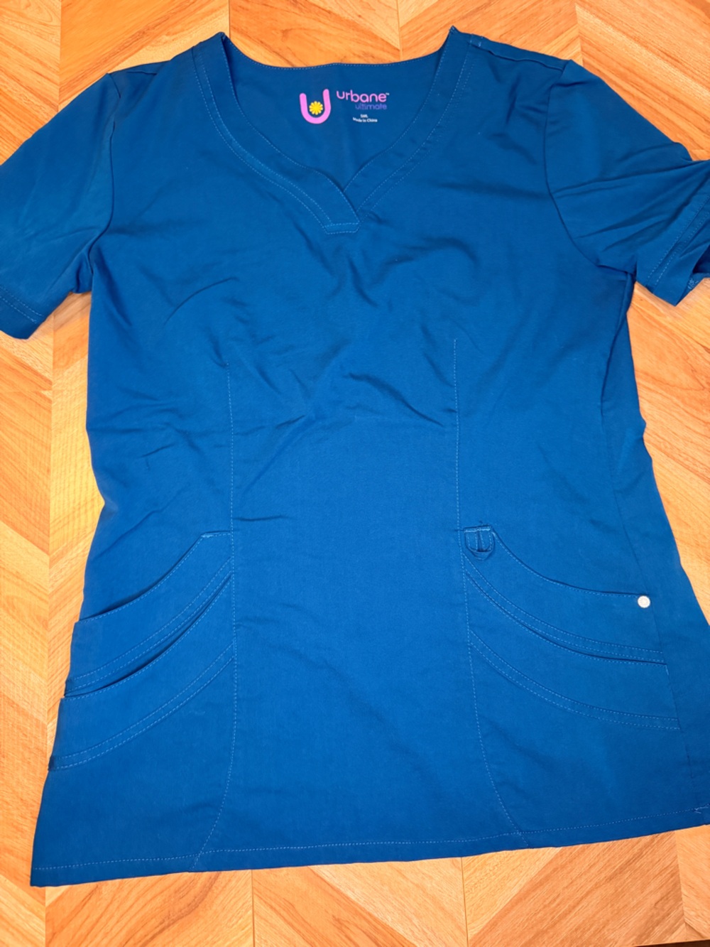 Urbane island Blue Tee with Pink and Yellow Logo